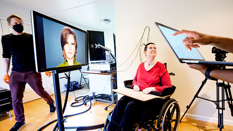 Woman connected to computers