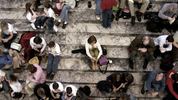 Woman sitting on the stairs alone