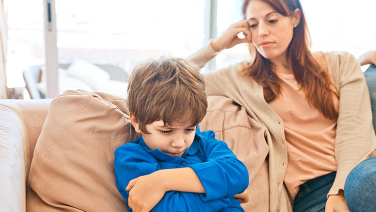 Child sitting with crossed arms