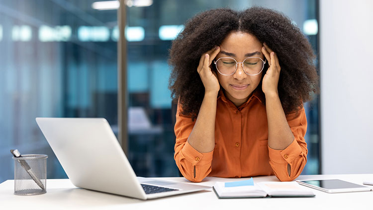 Woman with hands on head