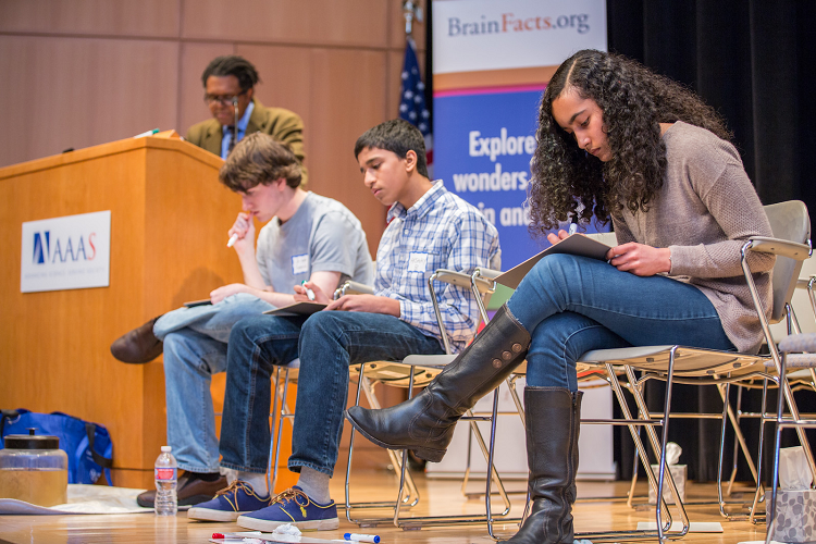 three high school students compete in the final round of the dc