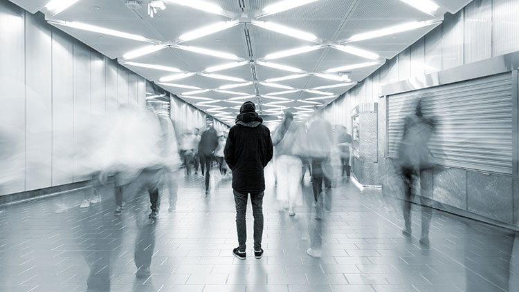 Man alone in a train station