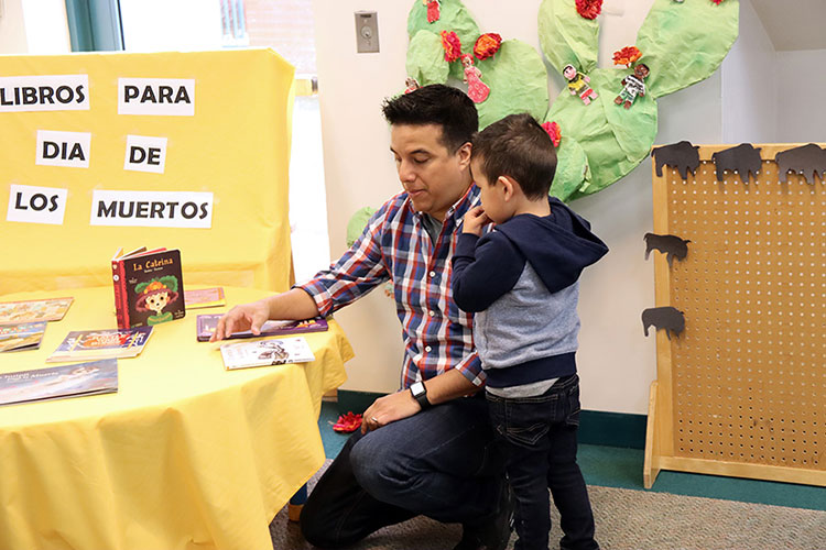 Father and son reading books