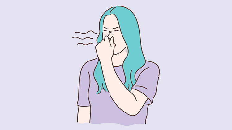 Woman smelling a bad odor